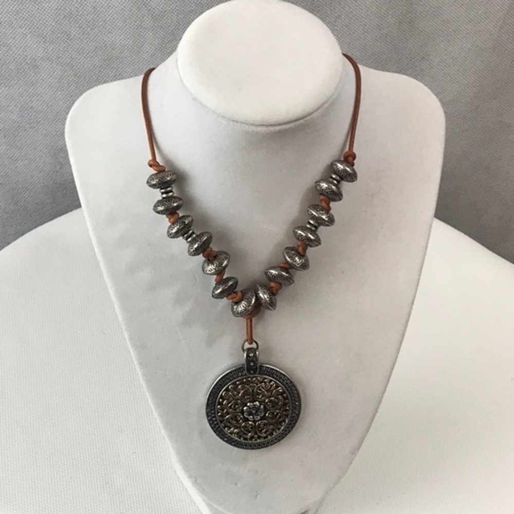 Metal beaded necklace with knotted leather string